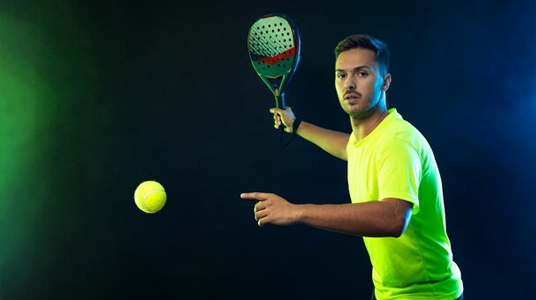 A focused pickleball player in a custom pickleball shirt, preparing to hit the ball with precision. Featuring high-performance pickleball outfits, including breathable men's pickleball shirts and lightweight apparel designed for agility and comfort on the court.